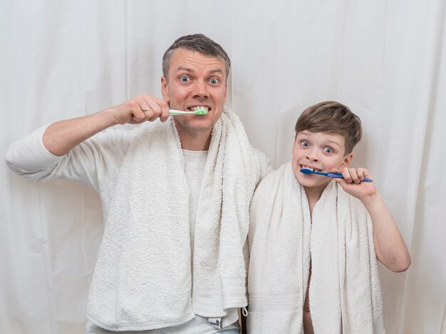 Father's day brushing teeth together