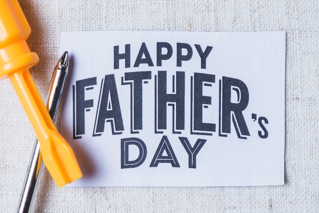 Free photo father's day card with two screwdrivers