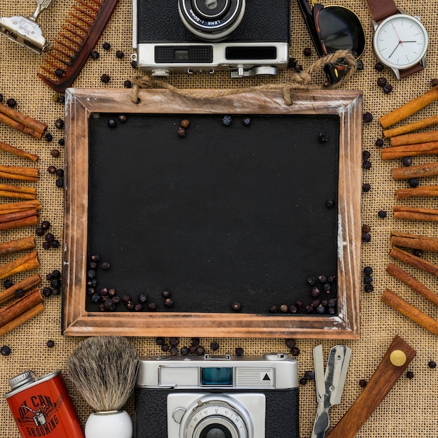 Free photo father's day composition with blank slate and decorative cinnamon sticks