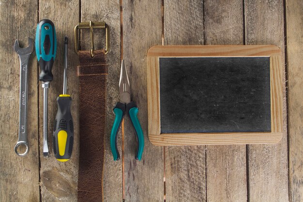 Father's day composition with blank slate and tools