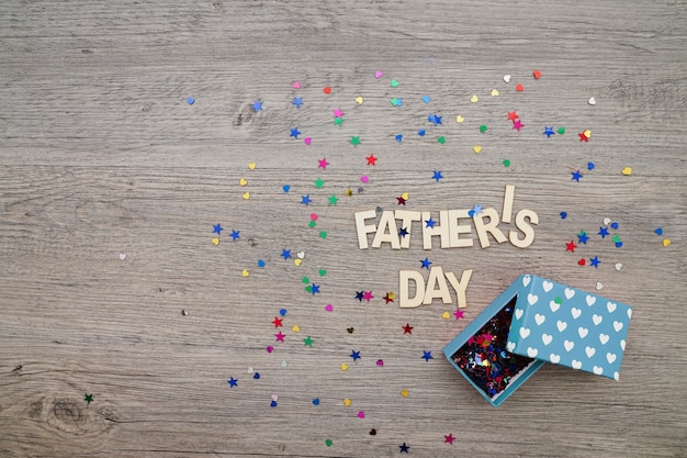 Father's day composition with confetti and gift box