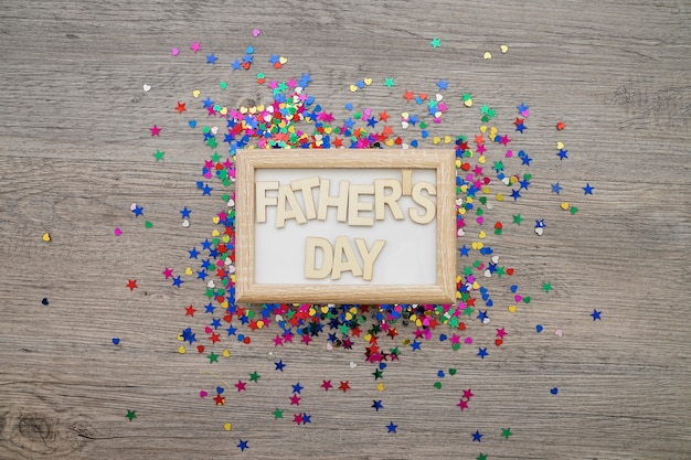 Free photo father's day composition with frame and confetti