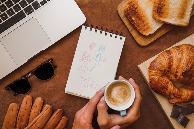 Father's day composition with hands holding a coffee cup