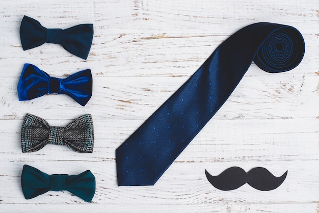 Free photo father's day composition with mustache, necktie and bow ties