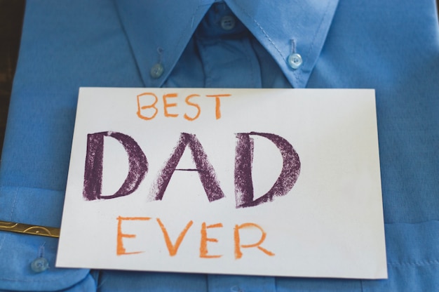 Free photo father's day composition with shirt and paper