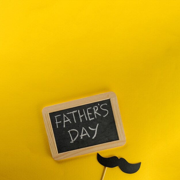 Father's day composition with slate and moustache