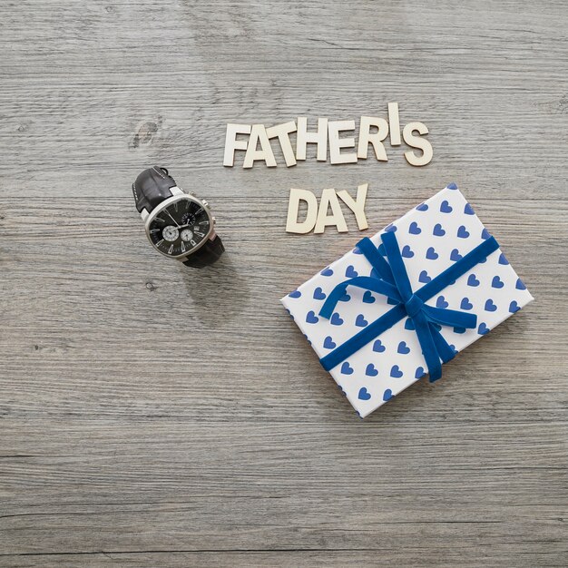 Father's day composition with watch and gift box