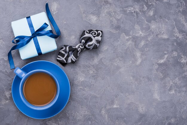 Father's day gift with ribbons with coffee and bow tie