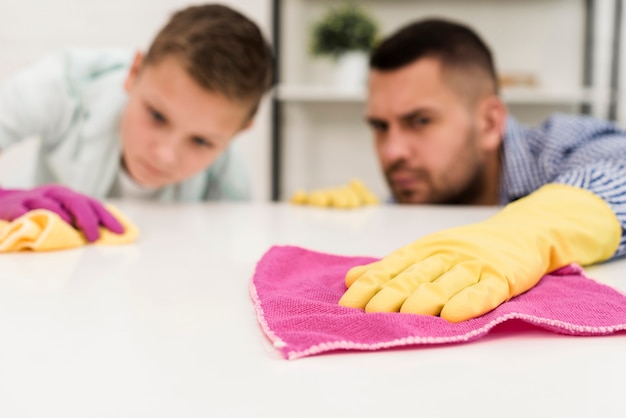 Father and son cleaning thoroughly