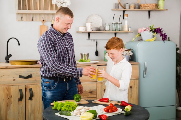 Father and son cooking together