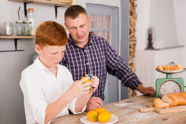 Father and son cooking together