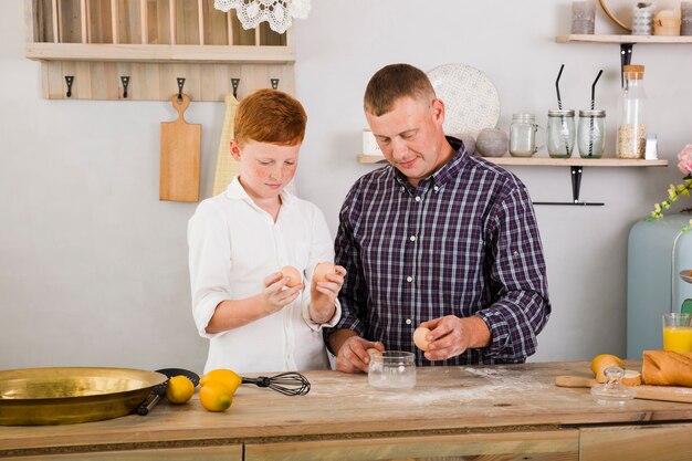 Father and son cooking together