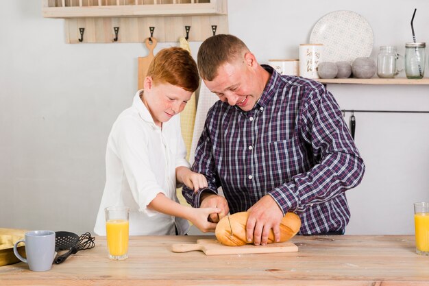 Father and son cooking together