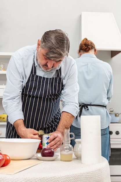 Free photo father and son cooking together