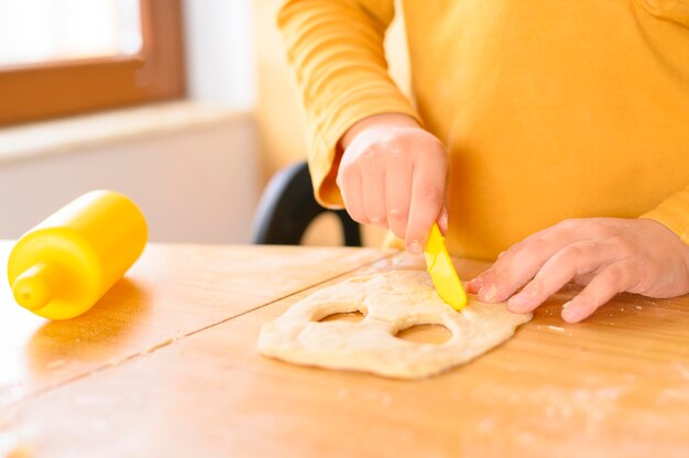 Father and son creating funny dough masks