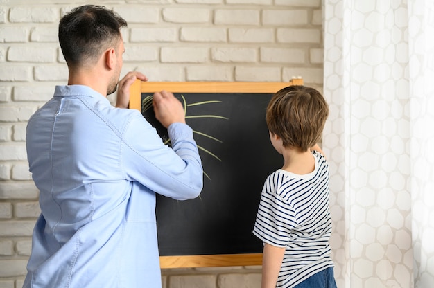 Father and son drawing together