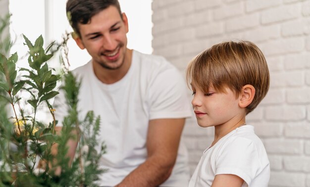 father and son learning about gardening together