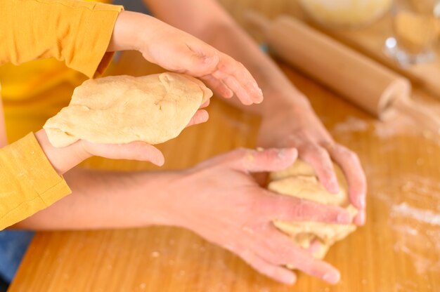 Father and son making some dough