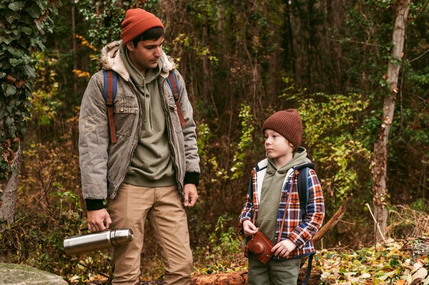 Father and son outdoors on a road trip in nature