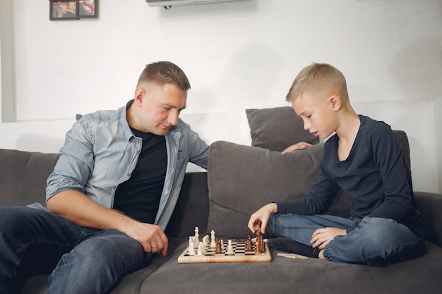 Father and son playing chess