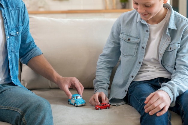 Free photo father and son playing in the living room