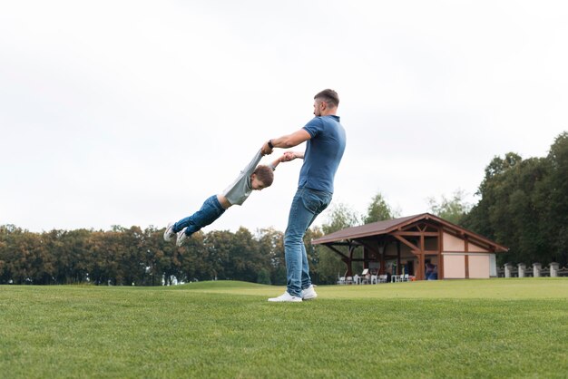 Father and son playing outdoors