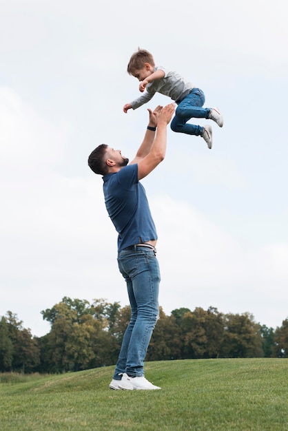 Father and son playing in park