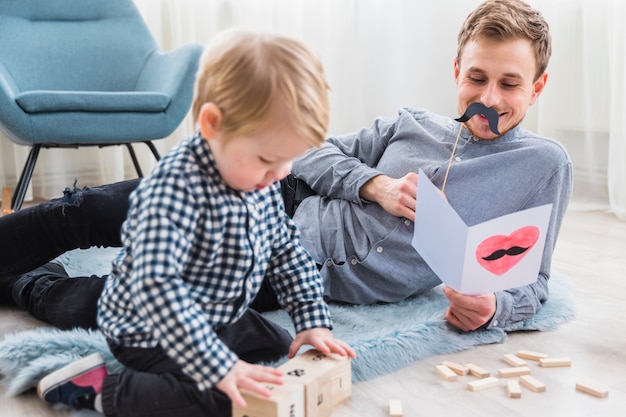 Father and son playing together on fathers day