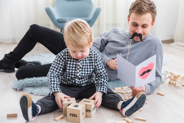 Father and son playing together on fathers day