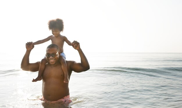 Father and son playing in the water