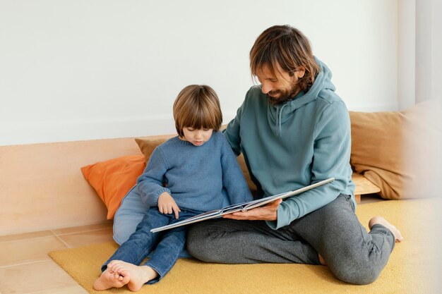 Father and son reading a book