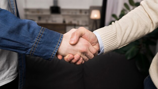 Father and son shaking hands