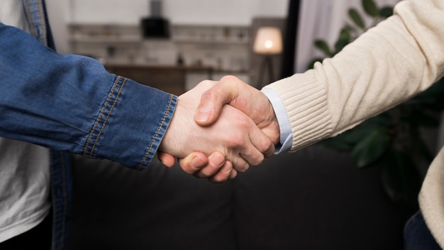 Father and son shaking hands