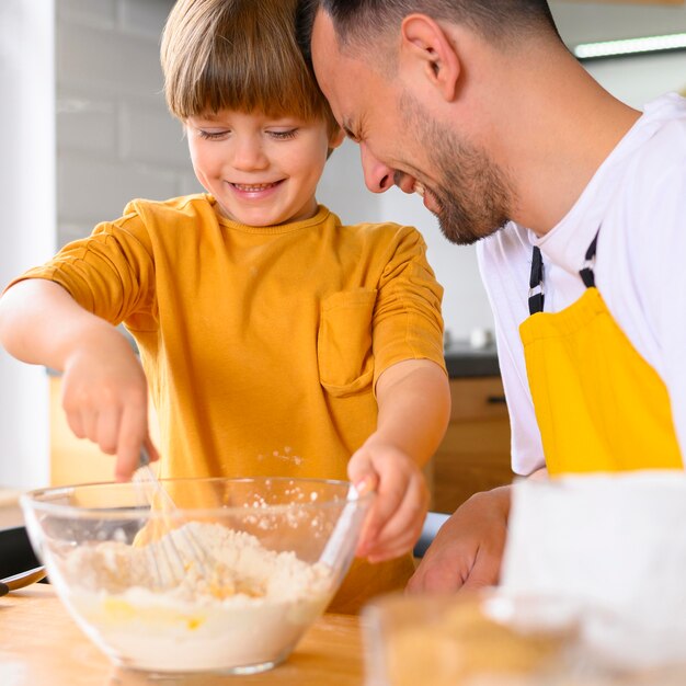 Father and son steering in the bowl