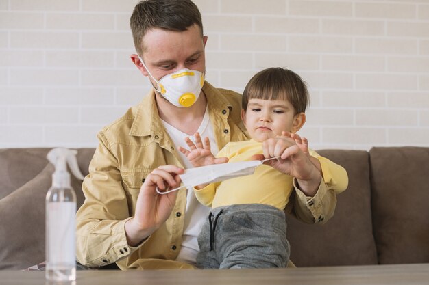 Father and son using medical masks