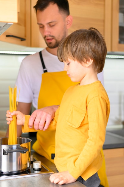 Father and son wearing yellow clothes