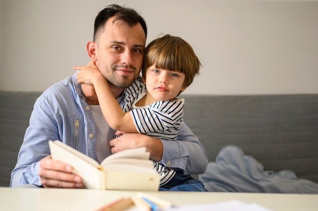 Father and son with book