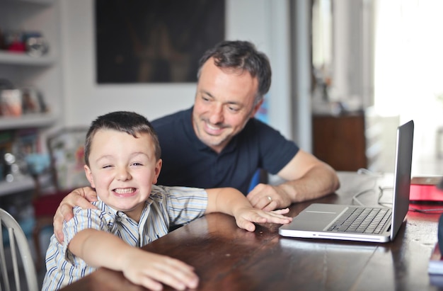 father and son with a laptop