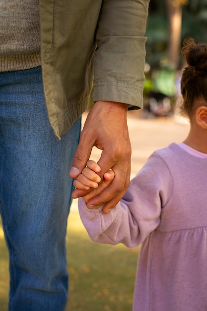 Free photo father spending time with his daughter outdoors on father's day