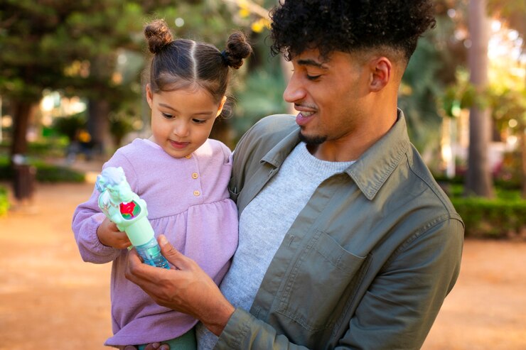 Free Photo father spending time with his daughter outdoors on father's day
