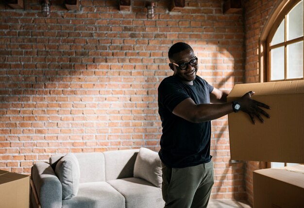 Father unpacking things in new house