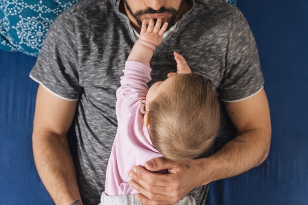 Father with his baby at home