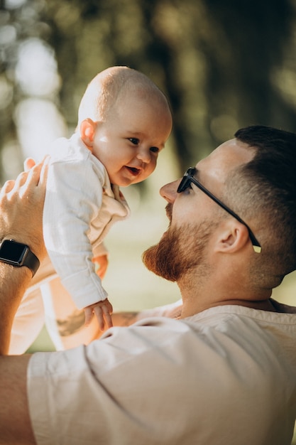 Father with his toddler daughter in park