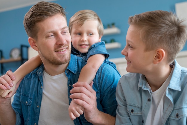 Father with siblings looking at each other