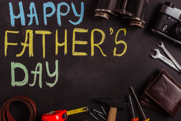 Free photo fathers day composition on blackboard with tools