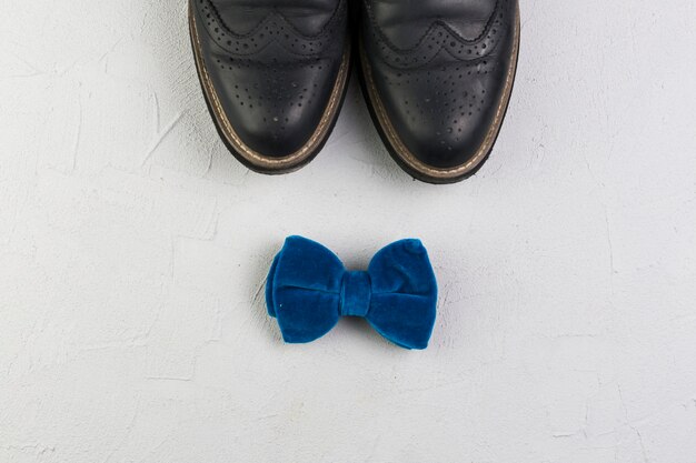 Fathers day composition with shoes and bow tie