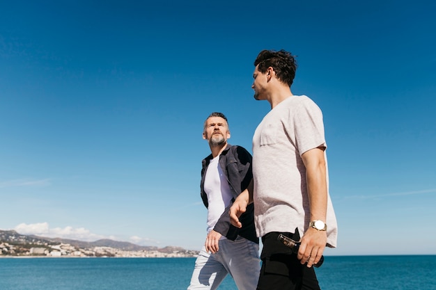 Fathers day concept with father and son walking together