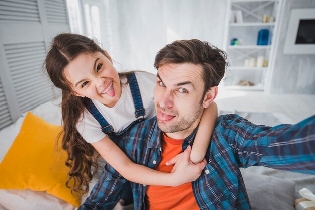 Fathers day concept with joyful father and daughter