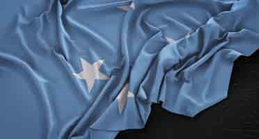 Free photo federated states of micronesia flag wrinkled on dark background 3d render