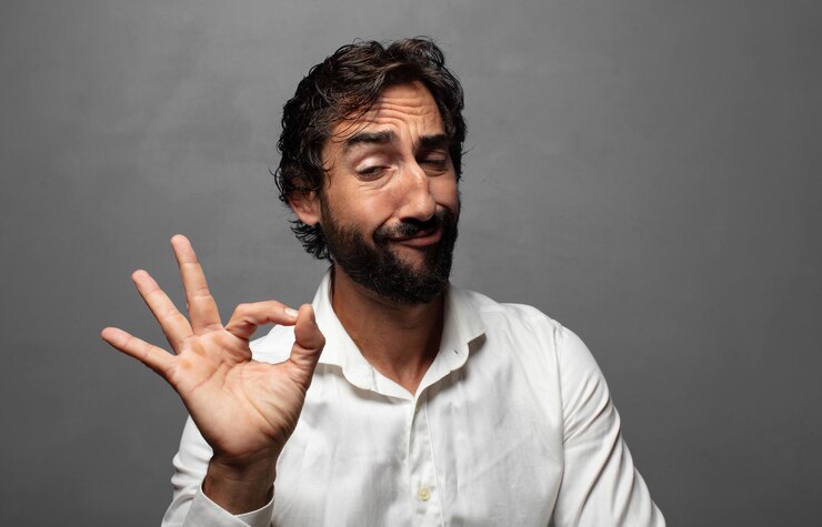 Free Photo feeling happy relaxed and satisfied showing approval with okay gesture smiling
